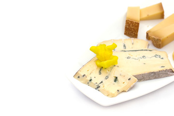 Cheese plate with different kinds of cheese with flowers.