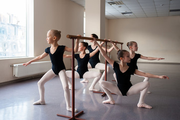 Children are taught ballet positions in choreography.