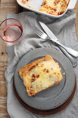 Lasagna Bolognese on a rustic table