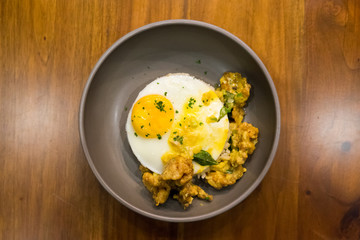 Butter rice with salted chicken crisp and fried egg