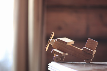 wooden toy airplane on the table