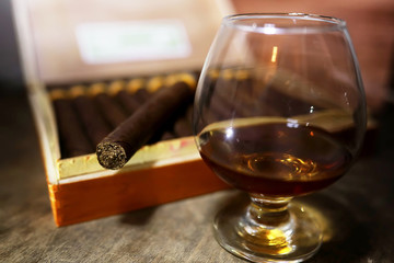 Large box of Cuban cigars on a wooden table