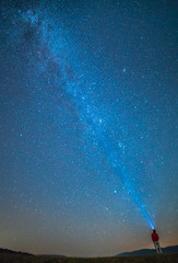 The man stand on the background of the stars in the sky. night time