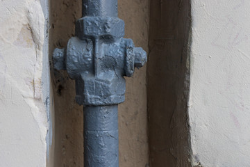 gas pipe build-in the peeling wall of a old house