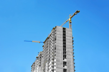 Crane and highrise construction site