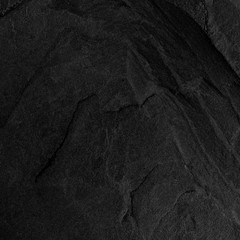 Dark grey black slate background or texture.