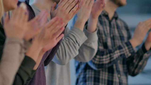 Satisfied proud business team clapping hands