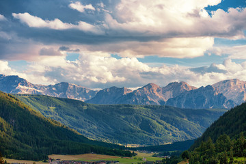 Fototapeta na wymiar The Santa Maddalena valley with mountain peaks in the background in the Dolomite Mountains, Italy