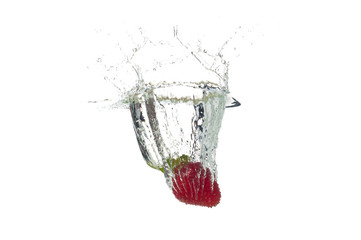Strawberry falling in the water with splash, isolated on a white background