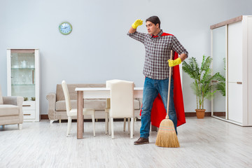 Super hero cleaner working at home