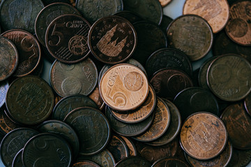 Images of euro coins. Many coins stacked on each other in different positions. Money concept.