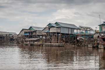 Cambodian river houses on stilts form an entire village.