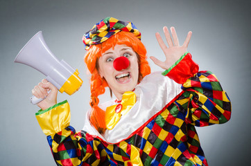 Funny clown in comical concept