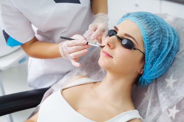 Naklejka premium ultrasonic face cleaning, peeling, in a beauty salon