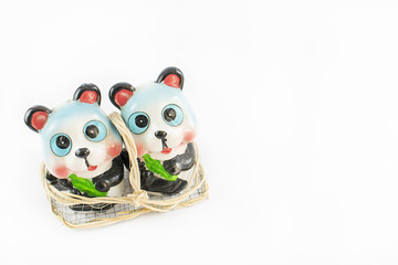 Fototapeta premium Salt and pepper bowl with a teddy bear.
