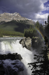 Fototapeta premium Athabasca falls with rainbow in Jasper National Park in Alberta Canada