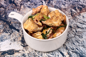 Stir-fried crab in curry powder is top-ten of popular Thai food.
