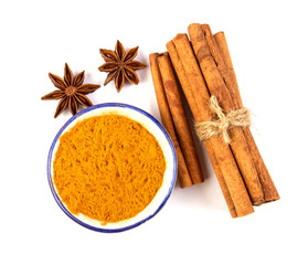 Close up  brown cinnamon stick and powder with star anise spice  isolated on white background