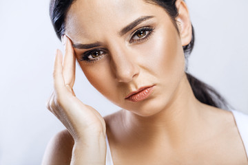 Health And Pain. Stressed Exhausted Young Woman Having Strong Tension Headache. Closeup Portrait Of Beautiful Sick Girl Suffering From Head Migraine, Feeling Pressure And Stress. High Resolution Image