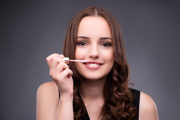 Fototapeta premium Young woman in beauty make-up concept