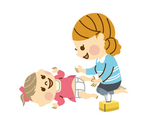  おむつ替えをするママ