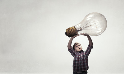 Boy catch light bulb. Mixed media