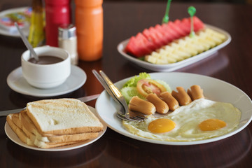 breakfast (fried egg and hot dog and bread)