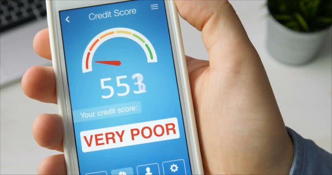 Checking credit score on smartphone using application. The result is VERY POOR