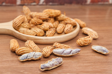 boiled peanuts on wooden plate