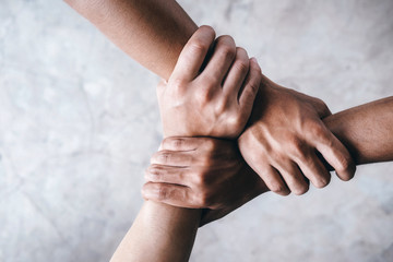 Hands together  showing teamwork.
