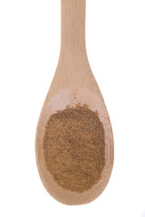Cumin powder on a bamboo spoon.