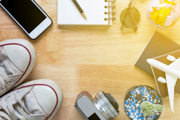 Outfit and accessories of traveler on wood background with copy space, Travel concept