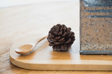 Dry flowers on a wooden table in coffee shop.