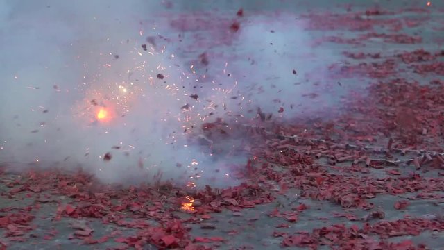 Slow motion Procession Taiwanese with traditional red firecrackers explode front temple of township in Taiwan festivals. Celebration Matsu God in the street of Taipei city-Dan