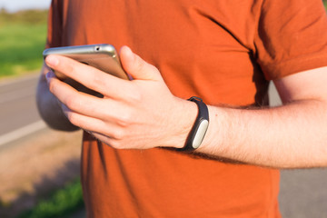 Sportsman checking his pulse on smart watch tracker