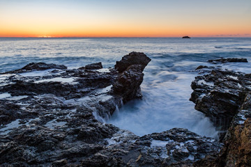 Sunrise over the rocks at Flagstaff hill - moving water
