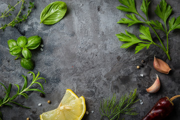 Selectionof herbs and spices on stone background
