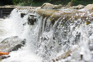 Small but rough falls in sunny day