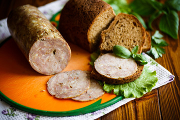 A sandwich with homemade sausage and rye bread