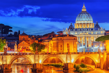Naklejka premium View on Bridge Vittorio Emanuele II (Ponte Vittorio Emanuele II) and Vatican city St. Peter's Basilica (Basilica di San Pietro) at night time. Rome. Italy.
