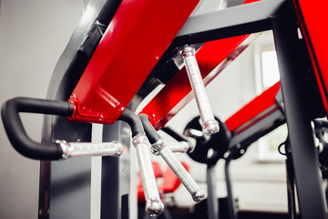 Modern interior of gym, close-up simulators and sports things.