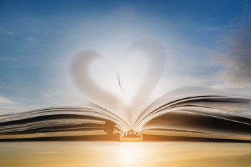 Heart shape on opened notebook page, vintage colors toned