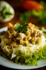 Boiled home-made noodles with gravy from eggplant
