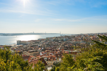 Lisbon roofs aerial view with bridge in the background, Portugal