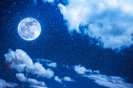 Night sky with bright full moon and cloudy, serenity blue nature background.