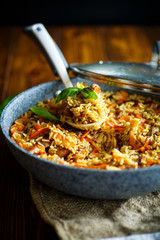 Pilaf with beef, carrots, onions, garlic, pepper and cumin.