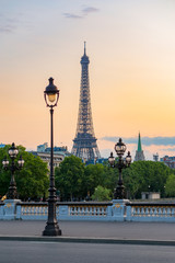 Fototapeta na wymiar Paris Eiffel tower and lamppost with orange sky, France