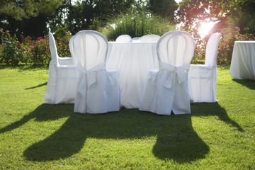 white table in the garden at wedding party