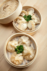 Chinese dumpling in a bamboo steamer box