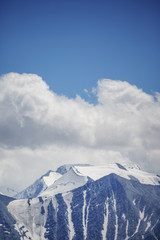 Fototapeta na wymiar Snowed peaks of the Altai Mountains